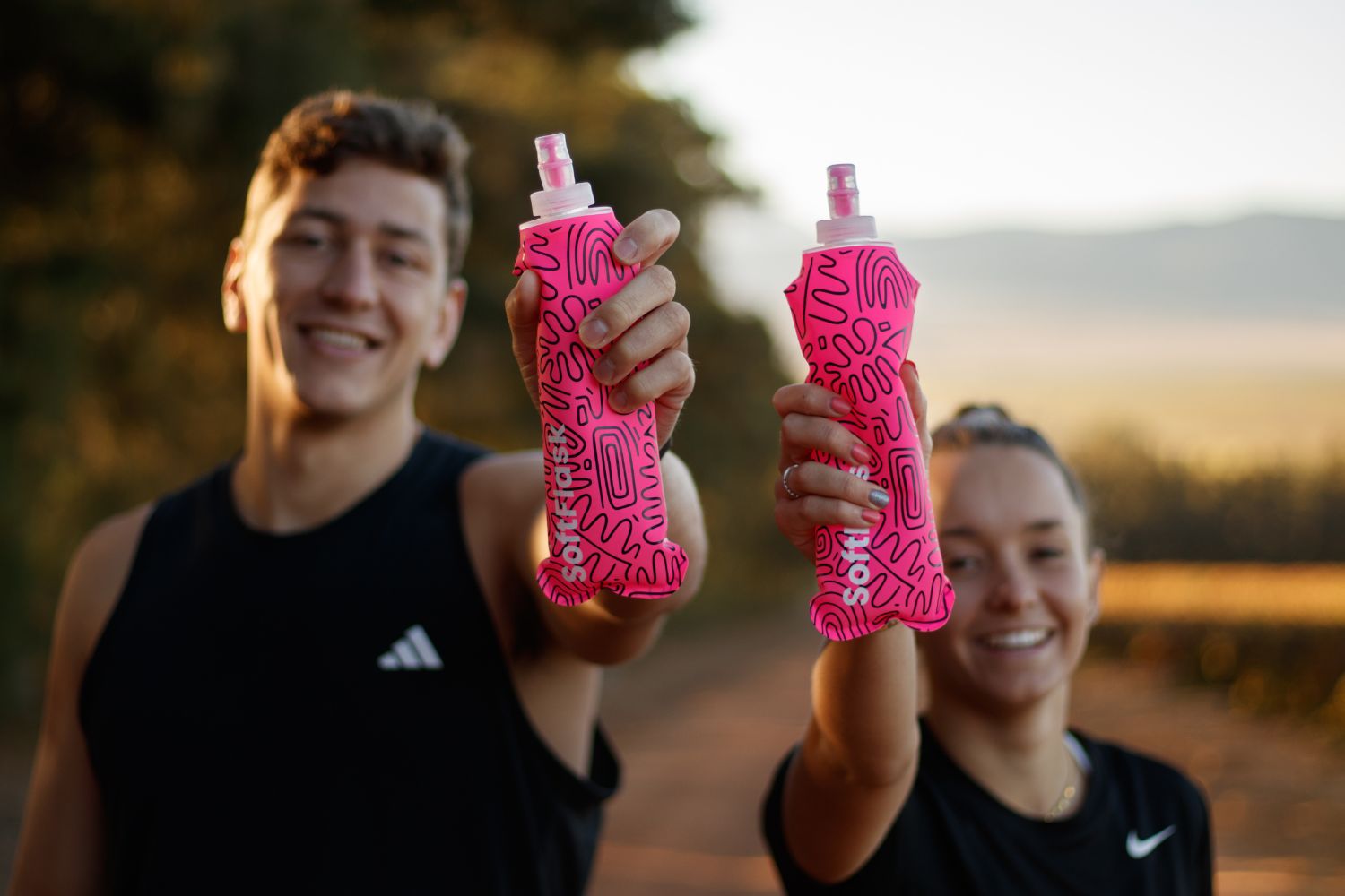 The founders of Soft flask is holding OG SoftFlasks in their hands.